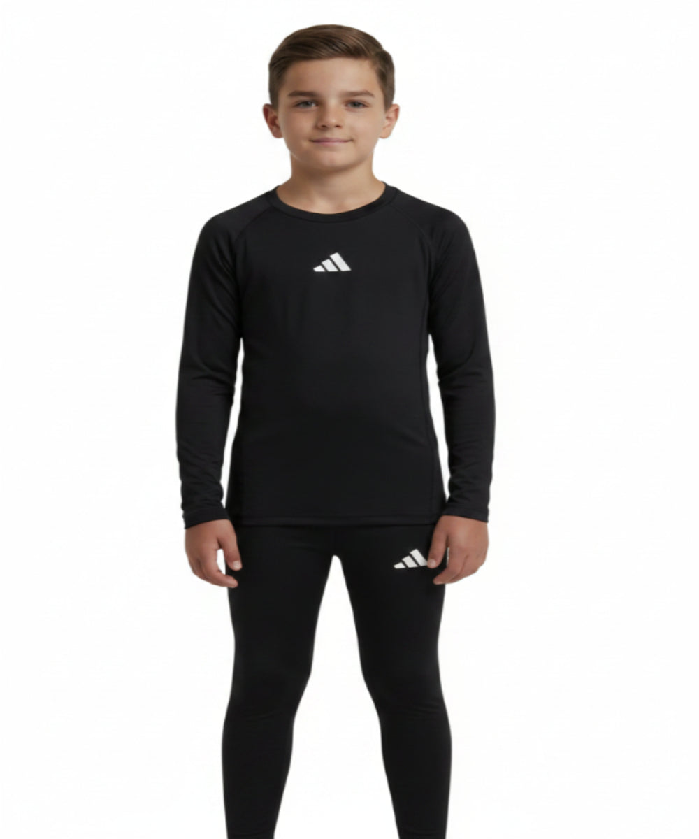 Base layer . Black sports long sleeve and stretch pants set with Adidas logo on a white background